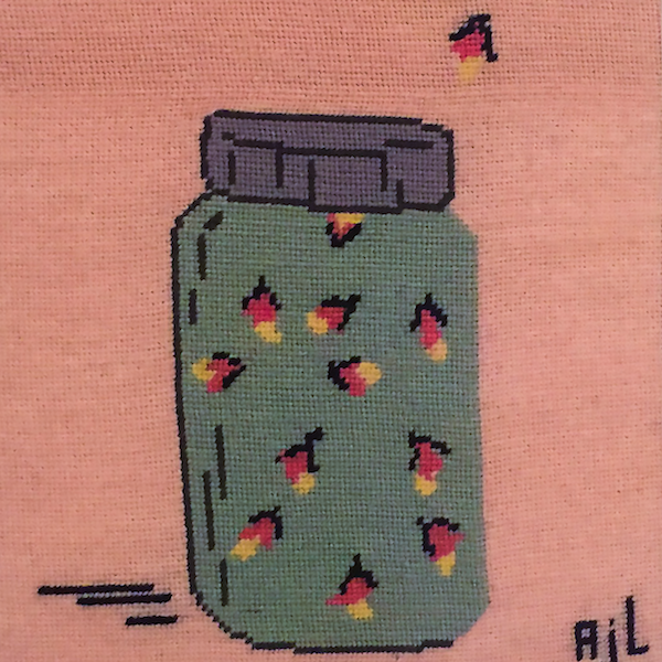 A cross stich of firefly's is a jar